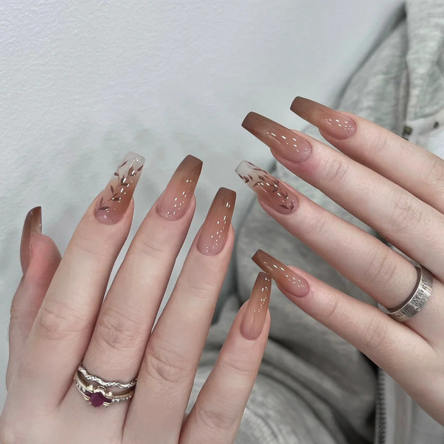 Fall and winter leaf nail art with caramel brown color, exuding a sophisticated and elegant vibe.