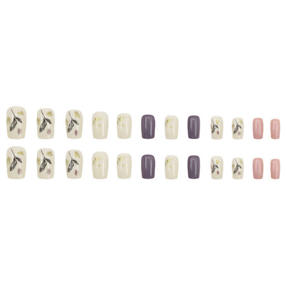 Leaves adorning gold foil manicure