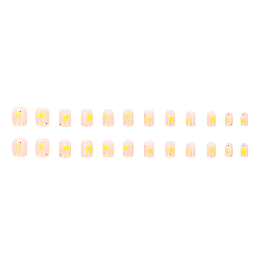 Cream-colored gradient yellow star nail polish