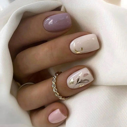 Leaves adorning gold foil manicure