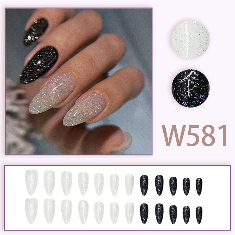 Long style almond-shaped nail polish in black and white style inspired by Ins
