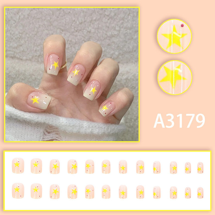 Cream-colored gradient yellow star nail polish