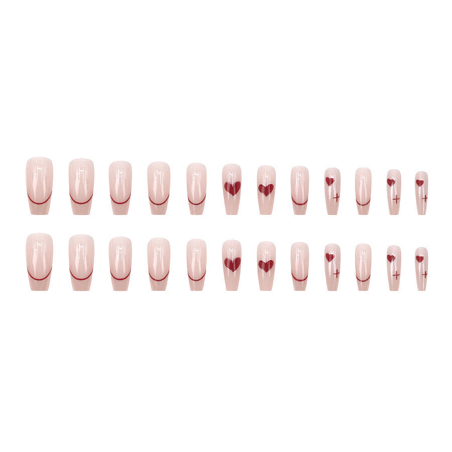 Red heart-shaped ballet shoes with nail polish