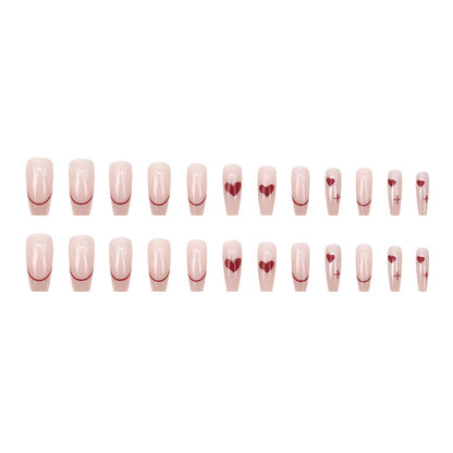 Red heart-shaped ballet shoes with nail polish