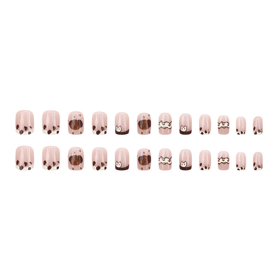 Cute spotted dog wearing nail polish