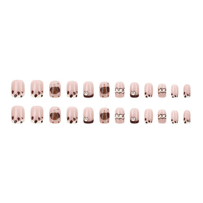 Cute spotted dog wearing nail polish