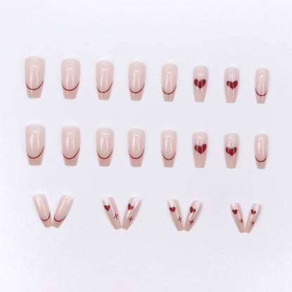 Red heart-shaped ballet shoes with nail polish