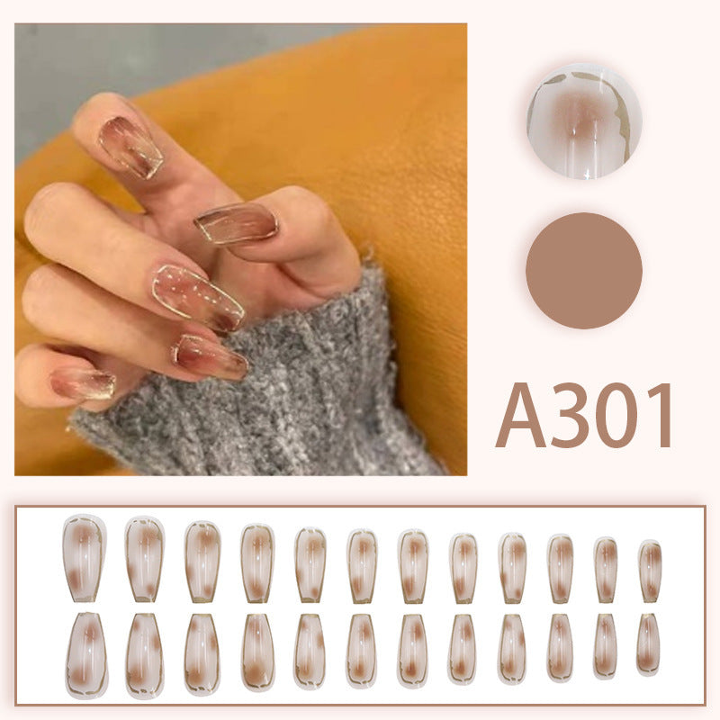 Sexy smoky eye makeup with gold edges and nail polish