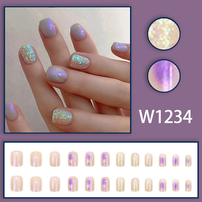 Glitter sprinkled on purple spots for nail decoration