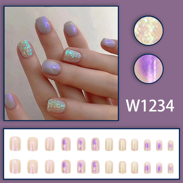 Glitter sprinkled on purple spots for nail decoration
