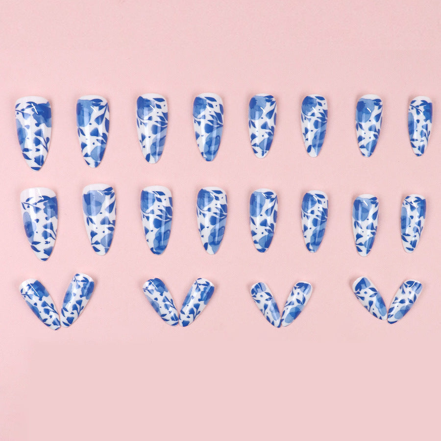Blue misty clouds, flowing floral patterns, adorned with nail designs