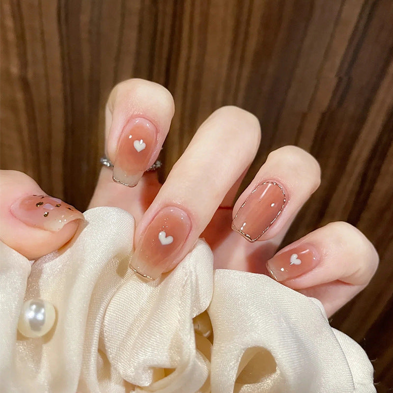 Ins-style nude gradient heart-shaped nail art with a nude gradient design and a heart shape.