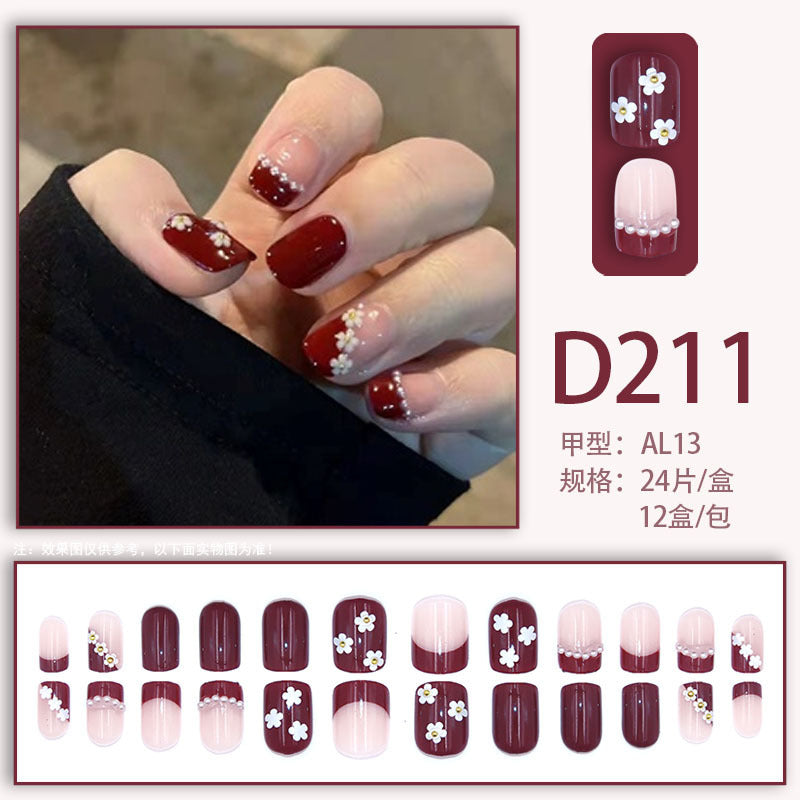 Red and white pearl-shaped small flowers worn as nail decorations