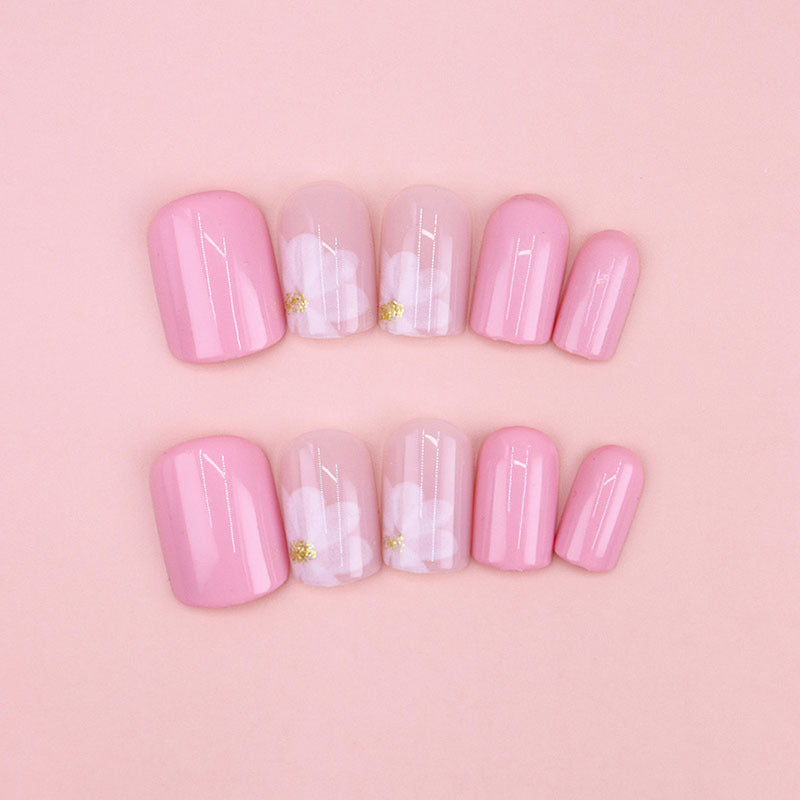 Nude-colored flowers adorned with nails
