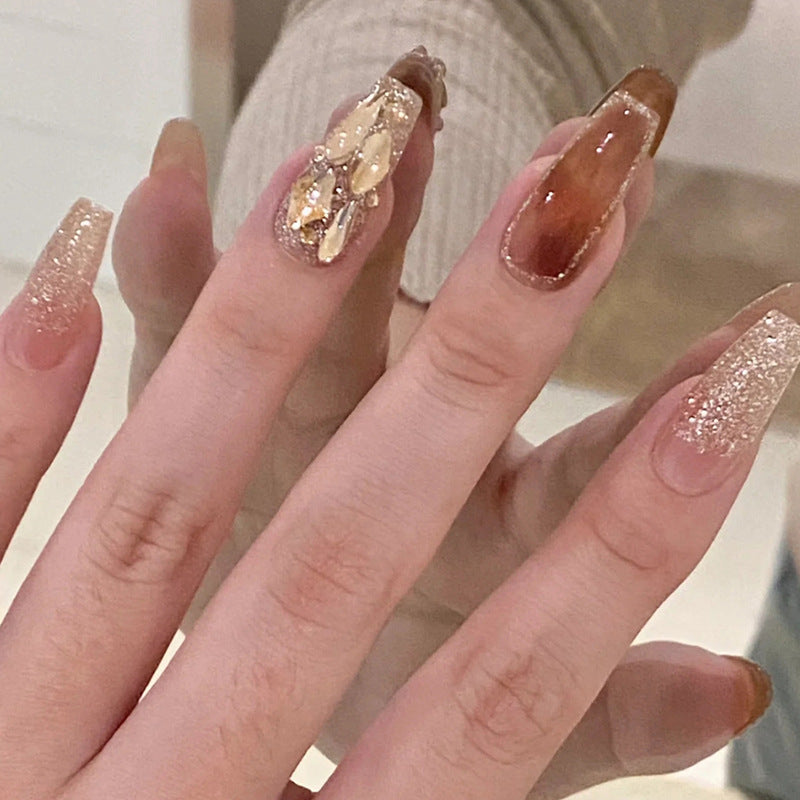Ultra-glossy champagne-colored manicure