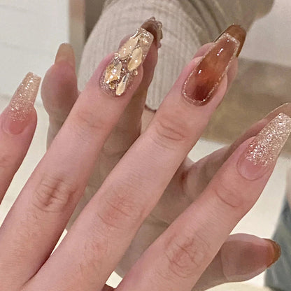 Ultra-glossy champagne-colored manicure