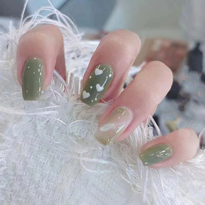 Green minimalist heart-shaped flower nail art