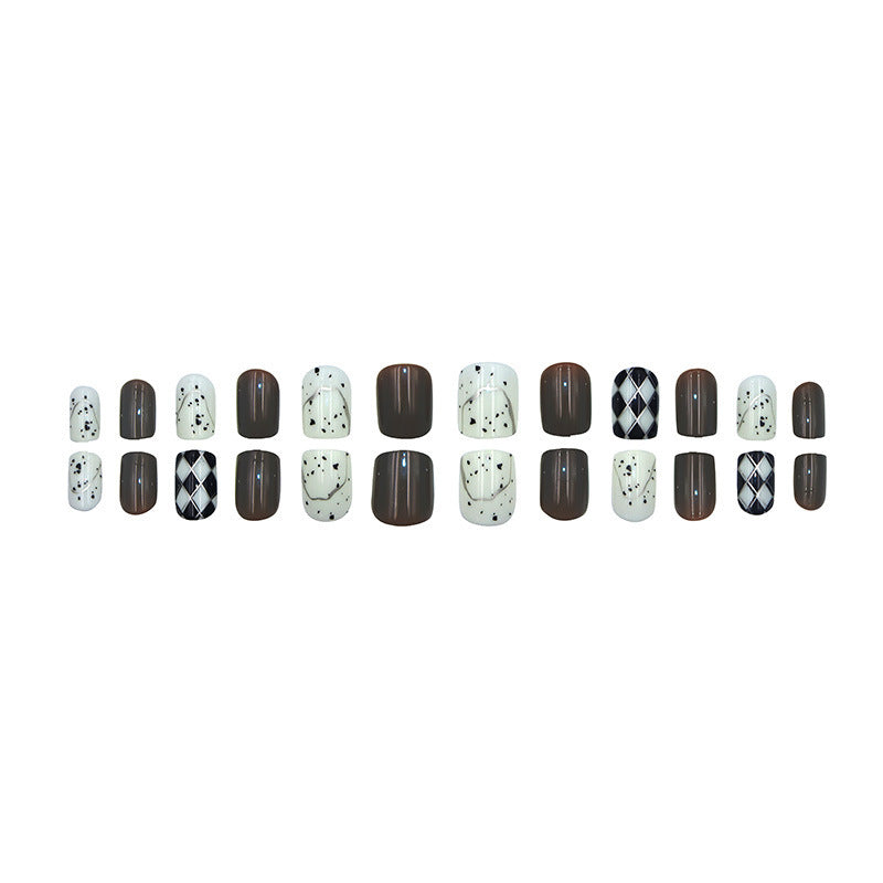 Diamond-shaped lines with polka dots on the nails