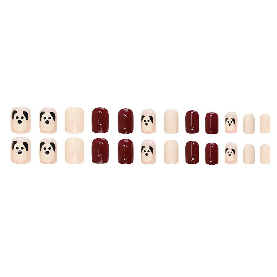 The little dog, named Wuxingren, has brown nail polish.