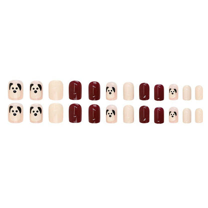 The little dog, named Wuxingren, has brown nail polish.