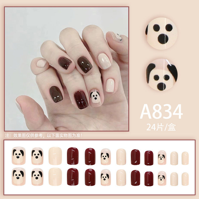 The little dog, named Wuxingren, has brown nail polish.