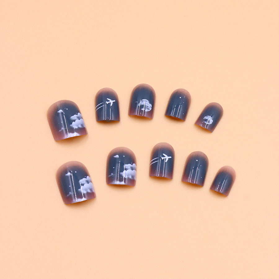 Dark blue aircraft wearing lunar-themed nails