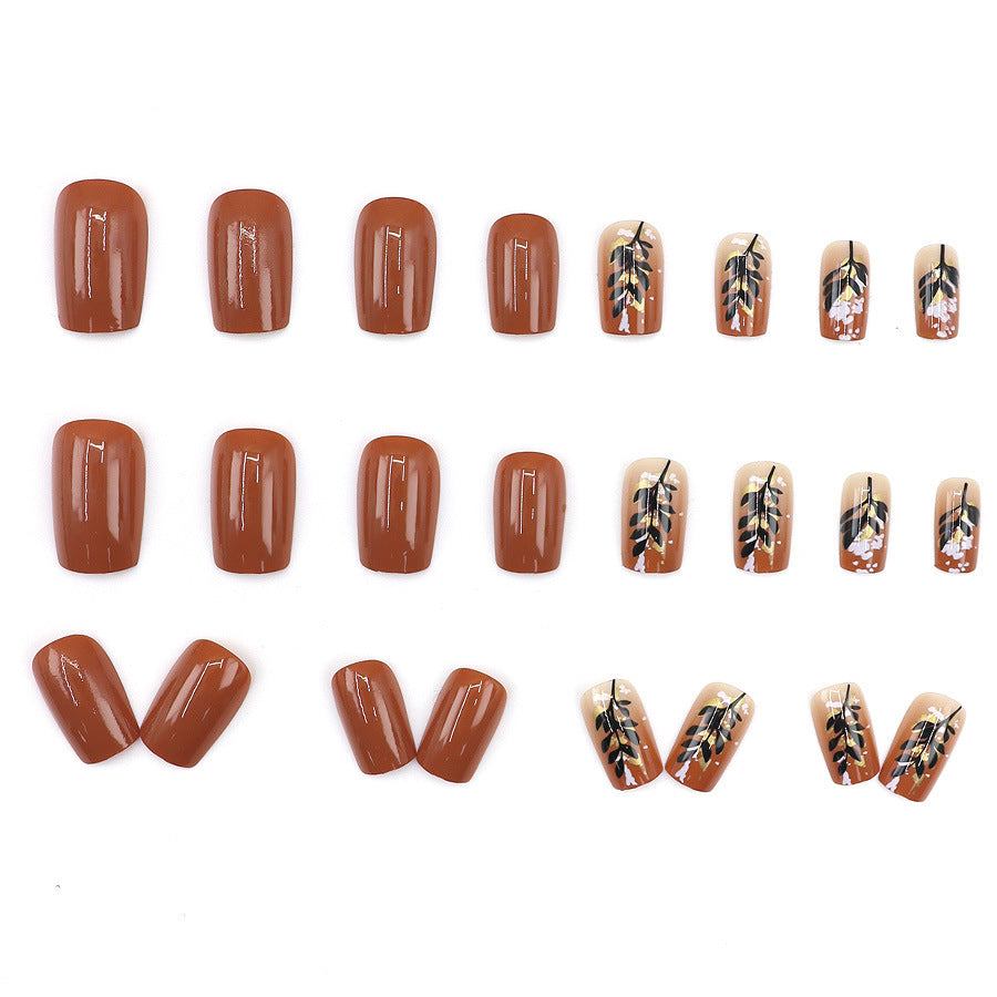 Caramel-colored leaves and gold foil manicure