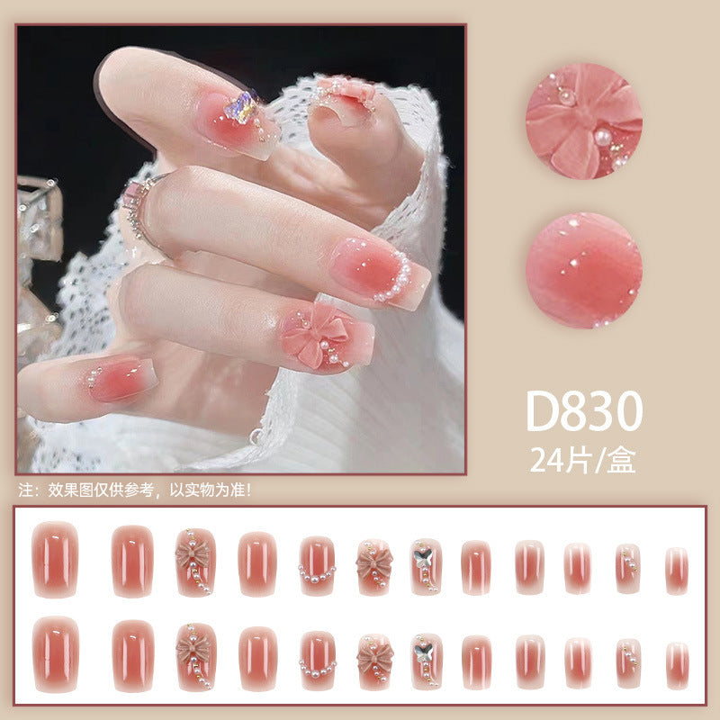 Red bow-shaped pearl manicure