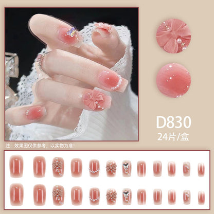 Red bow-shaped pearl manicure