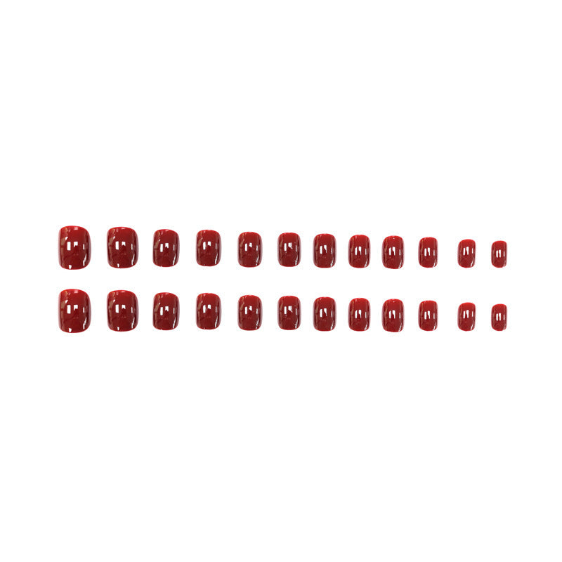 Dark red solid-colored manicure