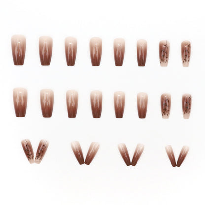 Fall and winter leaf nail art with caramel brown color, exuding a sophisticated and elegant vibe.