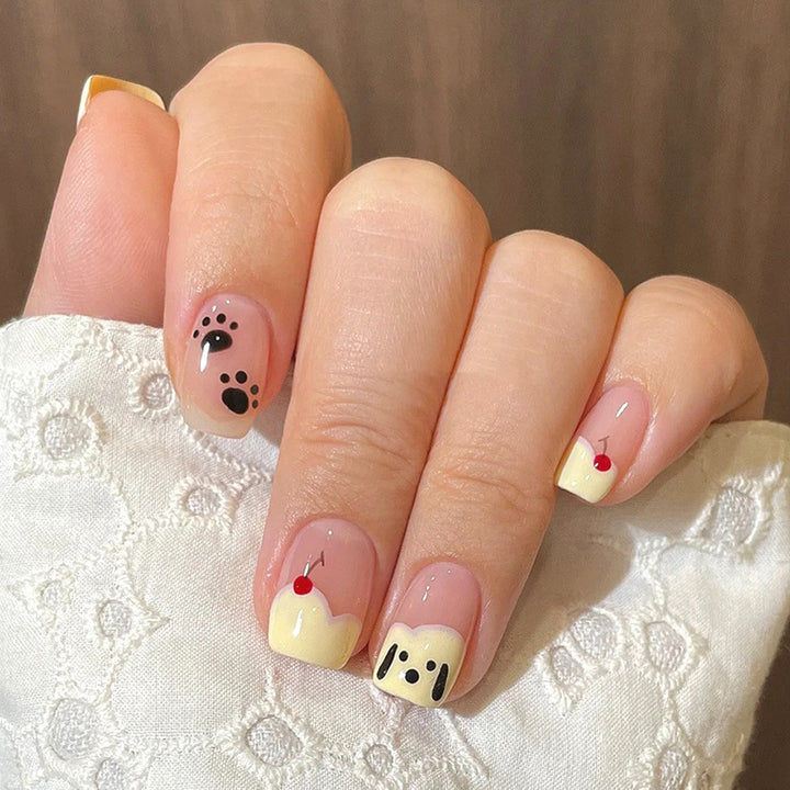 Cherry the puppy has its nails trimmed.