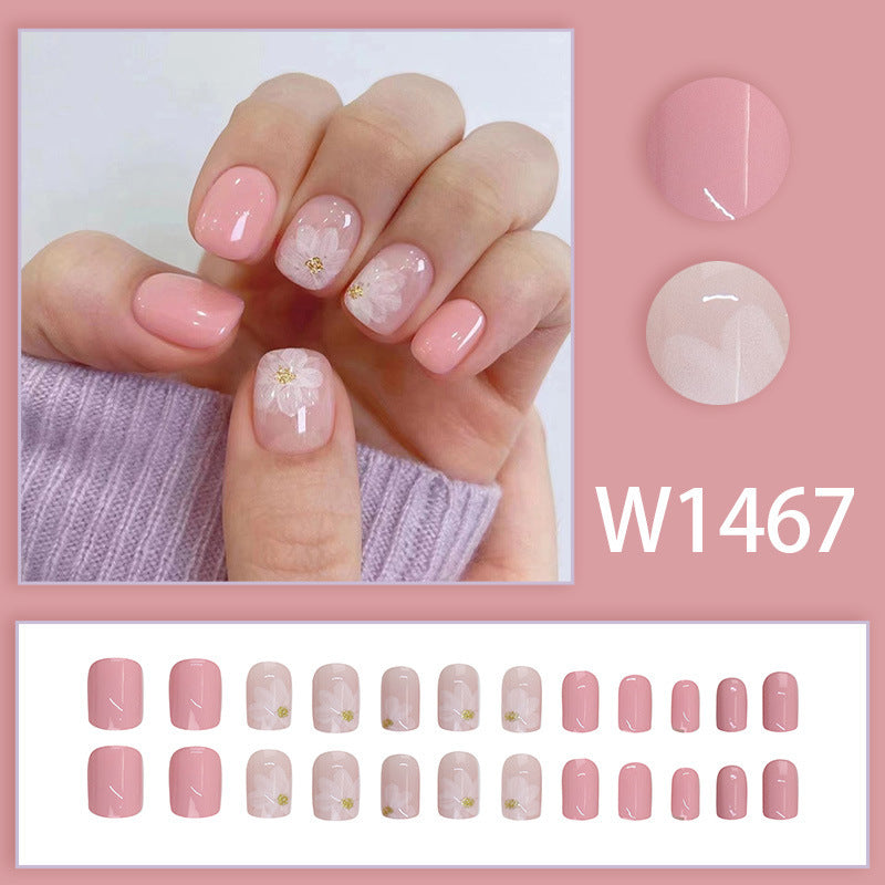 Nude-colored flowers adorned with nails