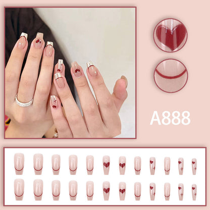 Red heart-shaped ballet shoes with nail polish