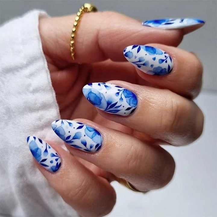 Blue misty clouds, flowing floral patterns, adorned with nail designs