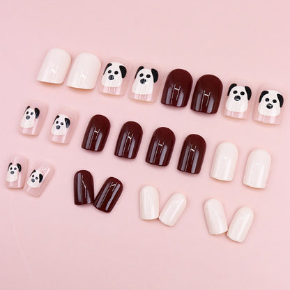 The little dog, named Wuxingren, has brown nail polish.