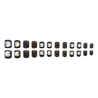 Black-colored small daisy smiling face manicure