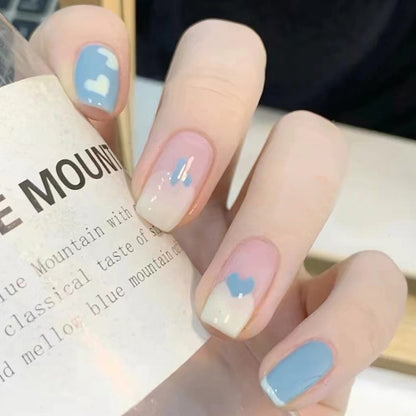 Dark blue and white heart-shaped nail polish