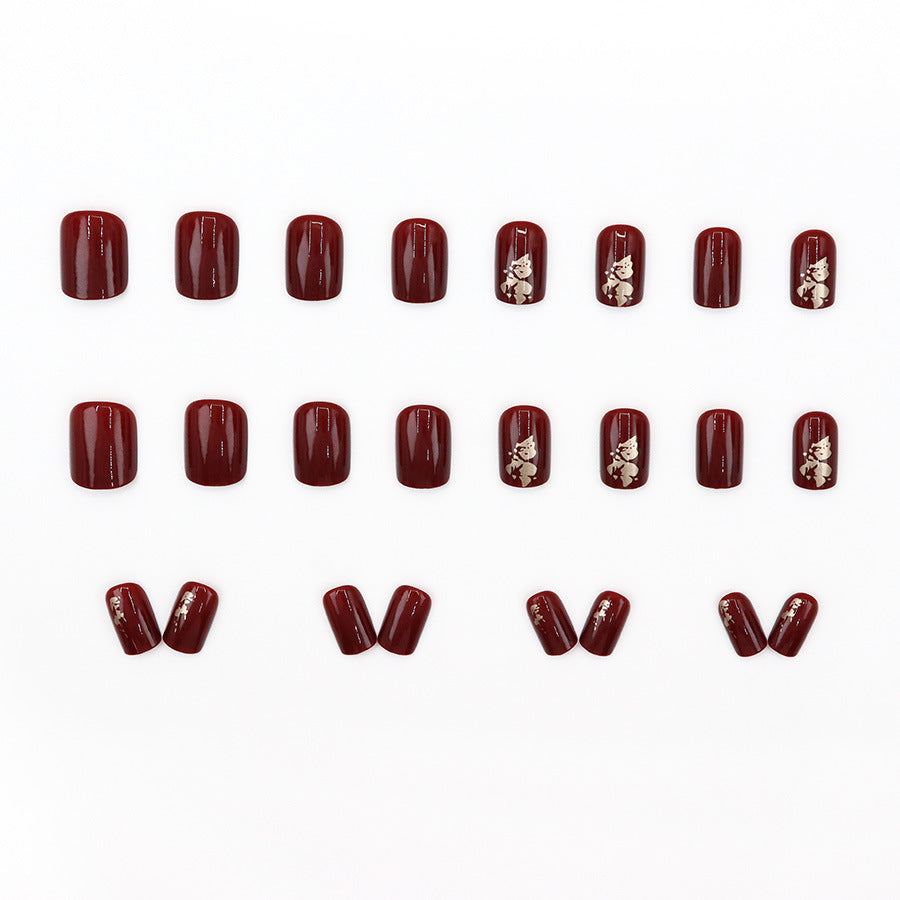 Anclara's red manicured nails
