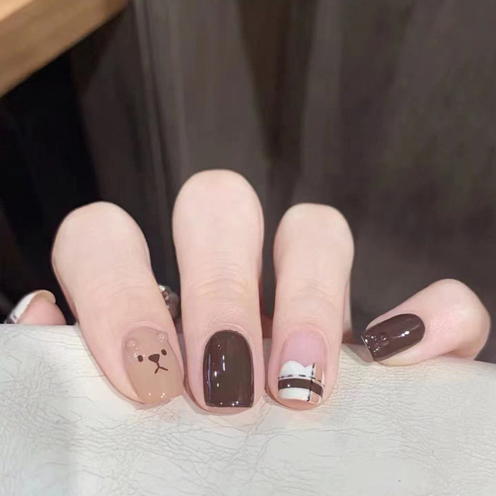 Cute little bear wearing nail polish