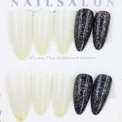 Long style almond-shaped nail polish in black and white style inspired by Ins