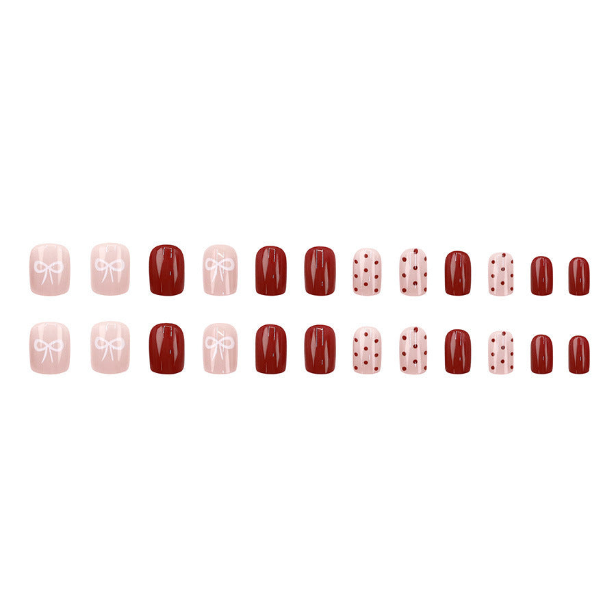 Red polka dot nude pink bow-shaped nail art