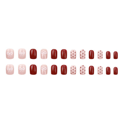 Red polka dot nude pink bow-shaped nail art