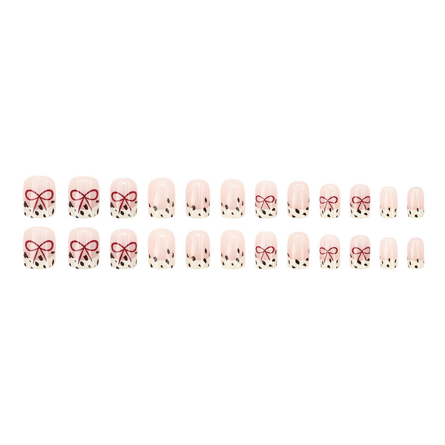 Bare color powder bow leopard print nail art