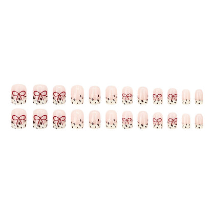 Bare color powder bow leopard print nail art